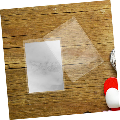 50 Pack Waterproof Card Sleeves With Magnetic Shielding Protectors on wooden surface, transparent PVC card holder displayed.