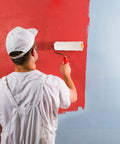 Man using a mini fleece roller for paint application on a wall, showcasing how to make your next wall painting project a total breeze with these pro grade mini fleece rollers that apply paint effortlessly and deposit a smooth as glass finish wherever your brush lands.