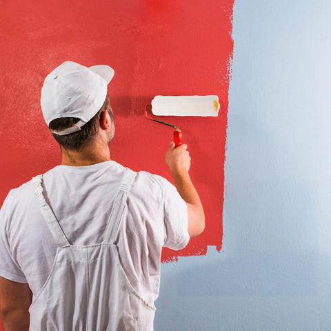 Man using a mini fleece roller for paint application on a wall, showcasing how to make your next wall painting project a total breeze with these pro grade mini fleece rollers that apply paint effortlessly and deposit a smooth as glass finish wherever your brush lands.