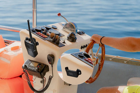 Boat dashboard with Heavy Duty Handheld Radio Holder For Walkie Talkie And Speaker Mic With Car Clip Mount, adhesive and screw fixation.