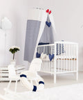 Floating Cloud Plug In Wall Sconce In Matte White With 6ft Clear Cord, 1 Light Ambient Bedroom Lighting over a nursery crib.