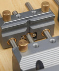 Close-up of Premium Blue Aluminum Bench Vise With Sliding Screw And Brass Jaws for CNC Machining and precise clamping.