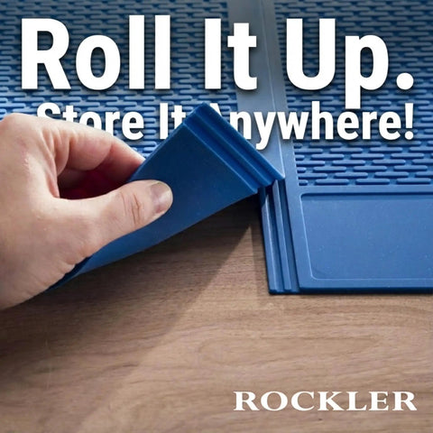 Person rolling up Silicone Glue Mat XL 23x30 Heat Resistant Craft Table Mat For Projects and Workbench on wooden surface