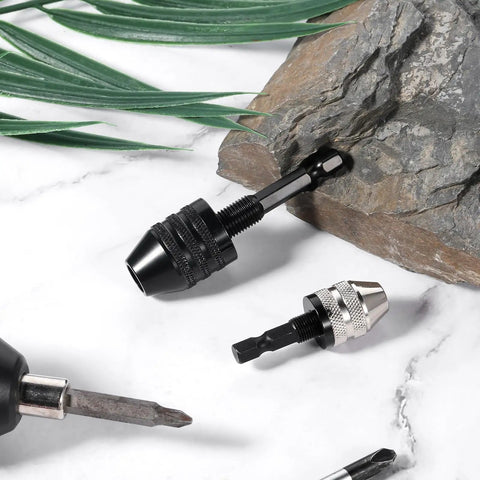 Two Pack Keyless Drill Chuck Set For Impact Driver With Quick Change One Quarter Inch Hex Shank Dual Size Chucks on stone