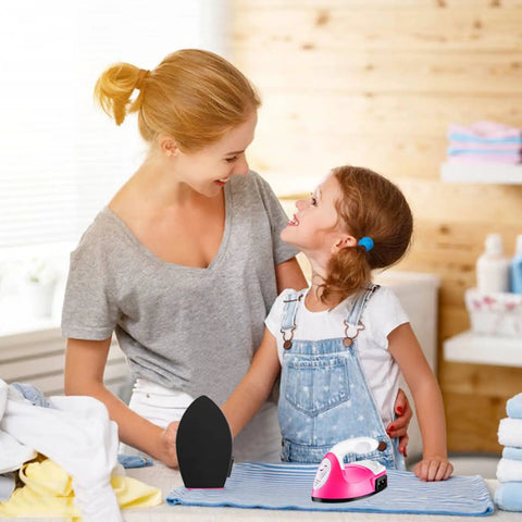 Mother and daughter using ACHENYUANYUAN Mini Heat Press Machine With Charging Base For DIY Crafts to iron clothes.