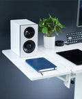 White Clamp On Desk Extender For A Sweet Home Office Upgrade Foldable Desktop Shelf with speaker, notebook, and plant.