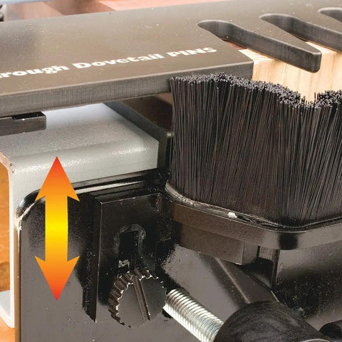 Close-up of a woodworking dust collection attachment for dovetail jig with adjustable sweep brush and sliding baffle