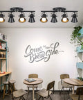4-Light Track Lighting Kit Black Semi Flush Mount Ceiling Light With Four Rotatable Heads in a modern cafe setting