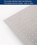 Close-up of Massive 12 Inch Ceiling Mount Rain Shower Head In Square Design with water droplets on brushed nickel finish