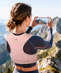 Person wearing Reflective Hydration Vest With 500ml Soft Flask And Phone Holder Go To Lightweight Running Pack for hiking.