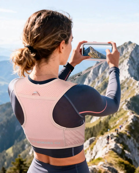 Person wearing Reflective Hydration Vest With 500ml Soft Flask And Phone Holder Go To Lightweight Running Pack for hiking.