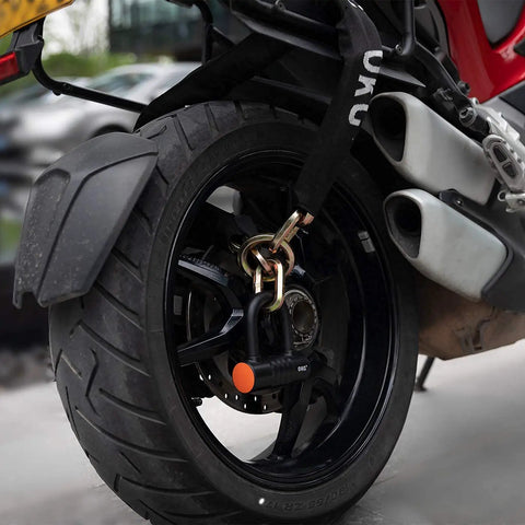Rear motorcycle wheel secured with Ultra Security Chain Beefy Heavy Duty Four Foot By Half Inch Hardened Alloy Steel Links and lock