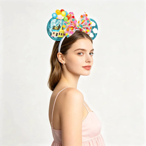 Side view of model wearing Blue Balloon Hut Sequin Ears Headband With Cloud Confetti Bow And Balloon House Charms for outings