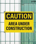 4 Pack Under Construction Signs 10x7 Inches Waterproof PVC Plastic For Worksite Safety Durable High Visibility Caution Hazard Area No Trespassing Yellow Black Signs mounted on fence