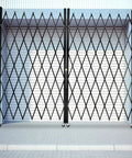 Heavy Duty Double Folding Security Gate Built Like A Tank For Garage And Warehouse With Rock Solid Expandable Metal Scissor Design and lockable rolling casters.