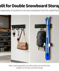 Split snowboard storage rack mounted on wall, holding snowboard, backpack, keys, and handbag in garage setting.