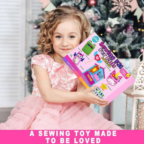 Child holding a Beginner Kids Sewing Kit With 6 DIY Projects Fun Prepunched Fabric Safe Plastic Needle No Glue Arts And Crafts Toy