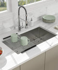 14 Inch Undermount Bar Sink For Kitchen And RV Use, 18 Inch Wide By 9 Inch Deep Single Bowl, 16 Gauge Stainless Steel Small Bar Prep Sink, Durable TRU16 T304 Construction That Resists Corrosion And Dents installed on a marble countertop with a high-arc faucet.