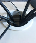Darn Sturdy Zinc Alloy Cable Hole Covers 2 Inch Mounting Hole Bronze Tone Desk Wire Grommets with multiple black cables.