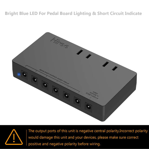 7 Way Isolated Guitar Pedal Power Supply with 9V 100mA Ports, 9V 300mA Port, and 2 AC Outlets on black casing, with polarity warning.