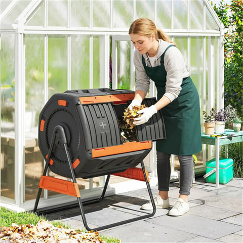 Person adding leaves to 53 Gallon Dual Chamber Compost Tumbler With Geared Rotation Adjustable Vents Elevated Base And Lockable Handle