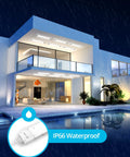 Modern house at night with IP66 waterproof exterior LED lighting showcasing Linkable 2Ft LED Shop Light 18W Lit Wraparound Ceiling Fixture Plug In 5000K