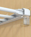 Heavy Duty Self Stick Shelf Brackets No Drill Adhesive Bracket Kit For Kitchen Cabinet Closet Bookshelf installed on wood surface with rod.