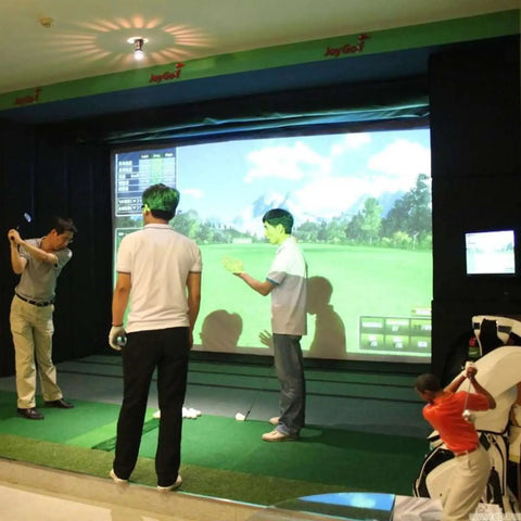 Indoor Home Golf Simulator System With Crystal Clear HD Projection Screen in use by group, featuring high clarity for realistic practice.