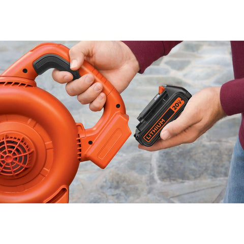 20V Max 15 Ah Lithium Ion Rechargeable Power Tool Battery held next to an orange leaf blower for easy installation.