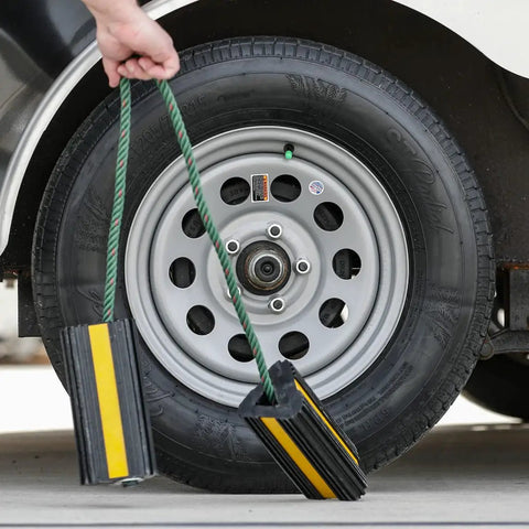 Heavy Duty Rubber Wheel Chock Set 4x4x8 With 36 Inch Nylon Rope Built Tough For Trucks Utility Vehicles And Ground Support Equipment Rust Proof And Chemical Resistant Reflective Tape For Safer Parking And Easy Carry next to vehicle wheel