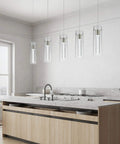 Modern Five Light LED Pendant Ceiling Fixture With Brushed Nickel Bubble Cylinder in a bright kitchen setting