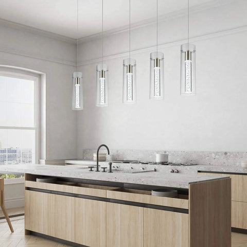 Modern Five Light LED Pendant Ceiling Fixture With Brushed Nickel Bubble Cylinder in a bright kitchen setting
