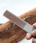 Workhorse 4 In 1 Wood Rasp File 8 Inch Straight Shooting shaping tool being used on wood for clean shaping and milling.
