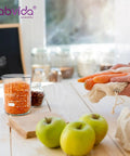 Kitchen scene with Six Pack 50Ml Thick Glass Beaker Set With 3.3 Boro Borosilicate Griffin Low Form on table with apples