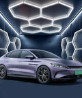 Modern car parked under hexagon garage lights 60W 24V daylight white 6500K plug and play LED kit with remote dimmer