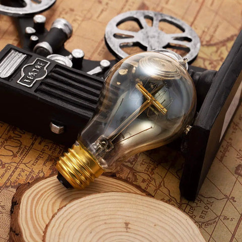 Edison Style Amber Filament Light Bulbs 40W A19 E26 Dimmable Antique Vintage Look Cozy Warm Glow 2700K 4 Pack for Home Bar Restaurant Decor Great For Mood Lighting In Kitchens Living Rooms And Cafes bulb on cinematic background