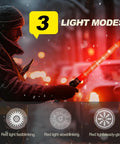 Person using 6-Piece 21-Inch Traffic Control Wand With 3 Flashing Modes Safety Baton Light in snowy weather, showing LED light modes.