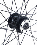 Close-up of all terrain mountain wheelset hub with 14G spokes, ED nipples, 6 bolt disc, suitable for six to nine speed drivetrains.