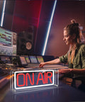 Woman using mixing console with On Air Neon Sign USB Powered For Recording Streaming And Podcast Home Studio in foreground