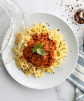 10 Inch Plate Cover Dome Shield For Mess Free Cooking And Keeping Leftovers Hot over pasta on white plate