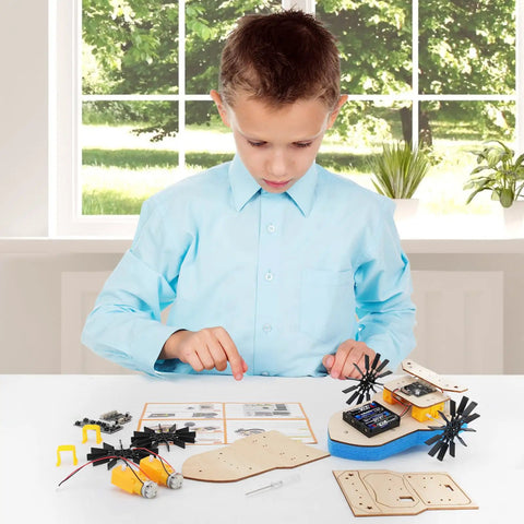 Child assembling Remote Control Boat Building Kit For Kids Ages 8-12, Paddle Boat Fun, STEM Science Project with wooden parts on table.