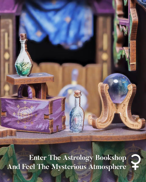 Close view of DIY Miniature Book Nook Kit with LED Light featuring astrology-themed bookshop decor with crystal ball.