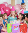 Kids at a party with 32 Pack Kraft Paper Gift Bags With Handles Six Color Rainbow Set For Birthday Parties Baby Showers Weddings And Crafts