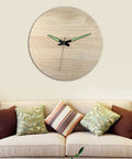 Wall clock with Quartz Clock Movement Kit For Repair And Replacement With Short Shaft above a sofa with large pillows in a living room.