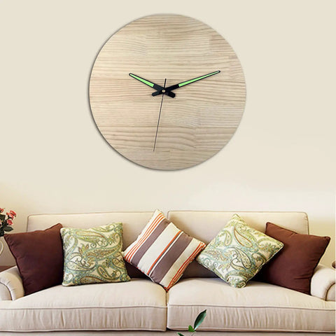 Wall clock with Quartz Clock Movement Kit For Repair And Replacement With Short Shaft above a sofa with large pillows in a living room.