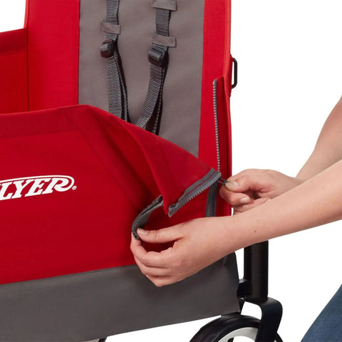 Person adjusting fabric on Convertible Wagon Stroller for Kids 1 Plus Beach Cart With Wheels All In One Red Wagon Kid Friendly