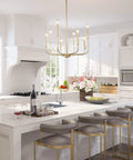 Gold Eight Arm Modern Chandelier With Two Height Options in kitchen setting above island with gray bar stools