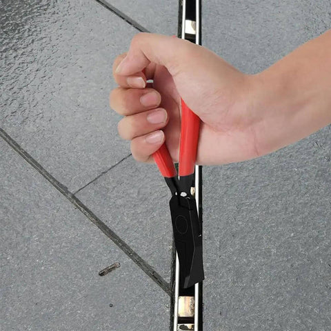 Hand using Three Piece Sheet Metal Bender Pliers Set for Roofing and HVAC Ductwork with red grip, bending metal edge
