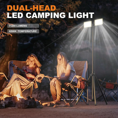 12V Dual Head LED Camping Light With Stand illuminating campsite with people, 11200 Lumens, remote-controlled and waterproof