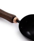 Close-up of Garden Scoop Shovel For Transplanting And Planting Stainless Steel Do It All Hand Digging Tool with walnut handle.